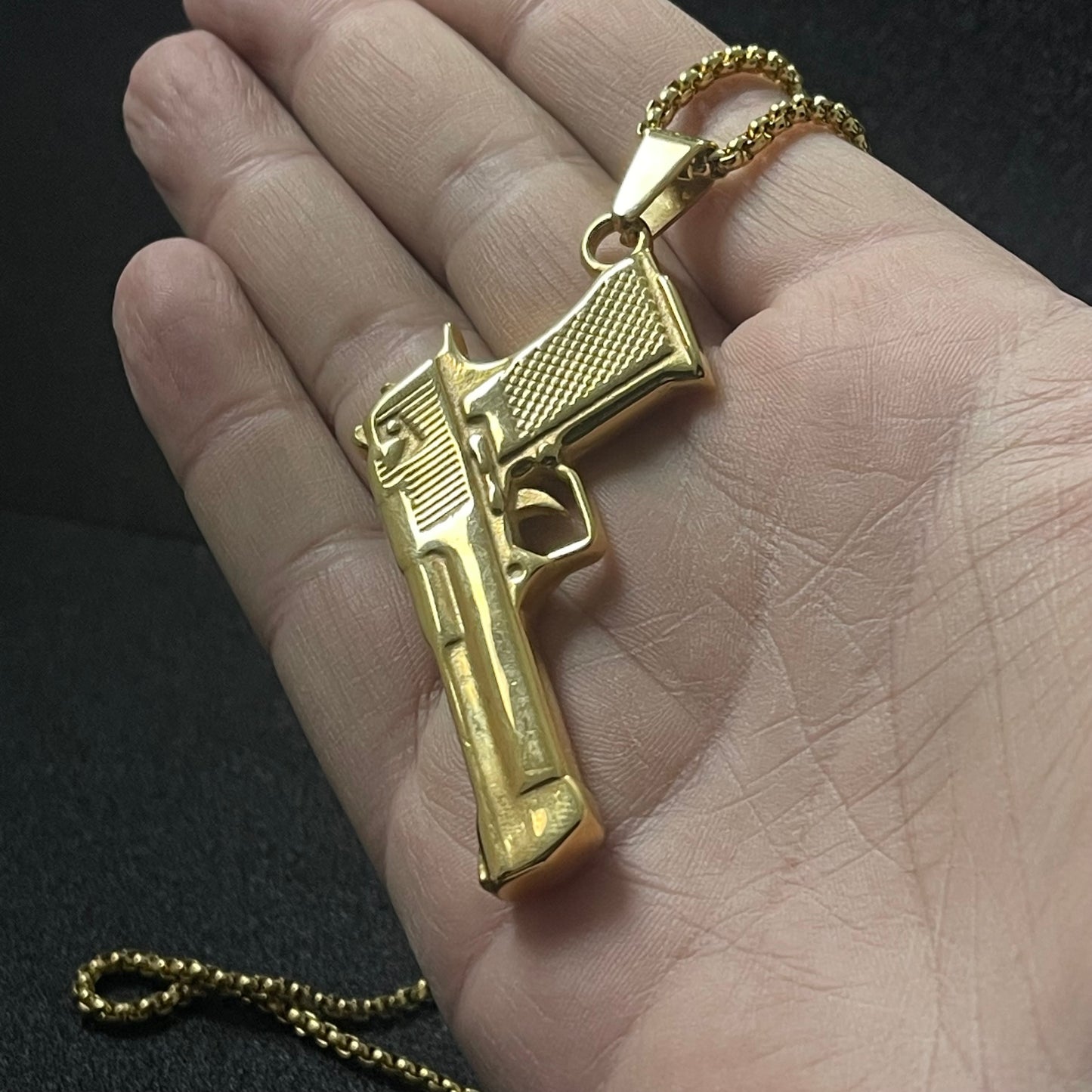 golden pistol rifle pendant necklace for men online in pakistan