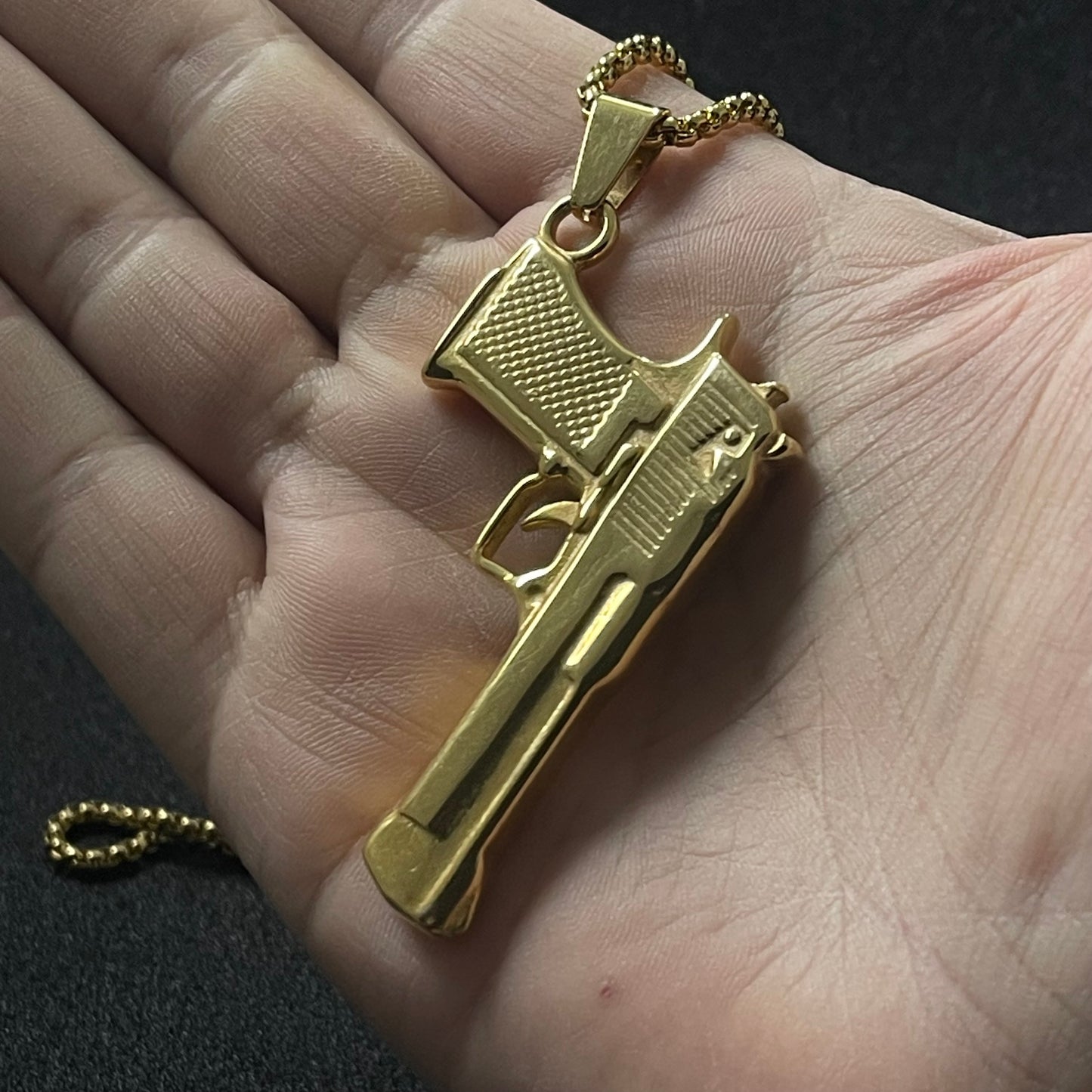 golden pistol rifle pendant necklace for men online in pakistan