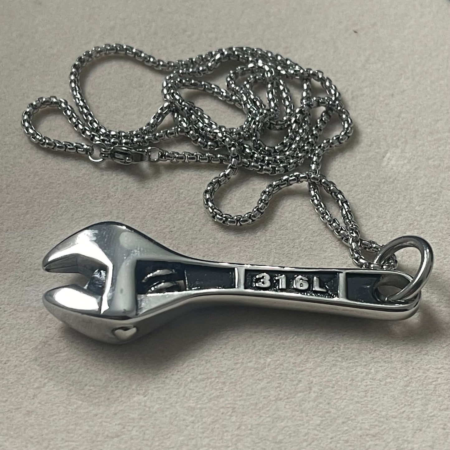 stainless steel golden wrench pendant necklace for men in pakistan