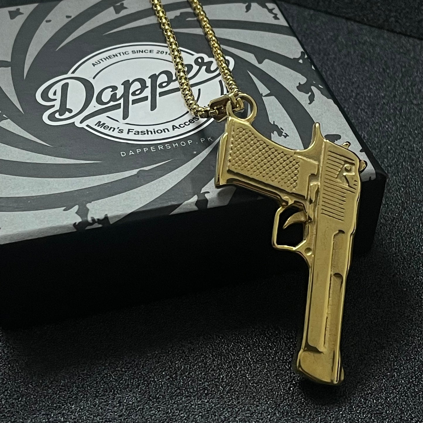 golden pistol rifle pendant necklace for men online in pakistan