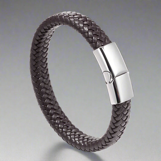 Brown braided leather bracelet with a silver clasp on a white background