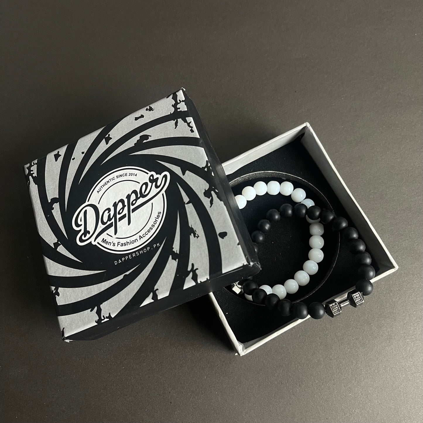 white and black dumbbell beads bracelet in Pakistan