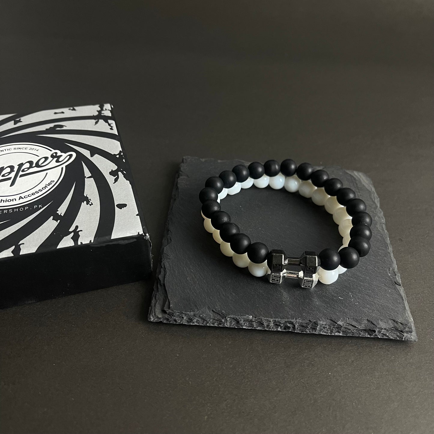 white and black dumbbell beads bracelet in Pakistan
