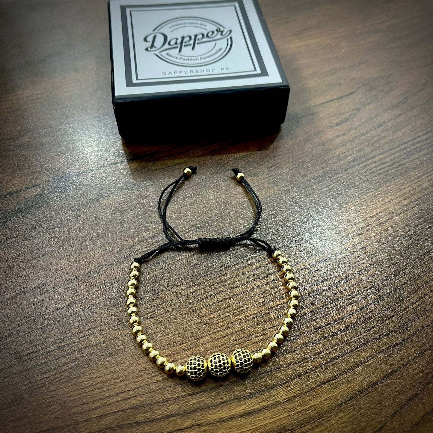 Golden Cubical Zircon Paved Triple Beads Bracelet