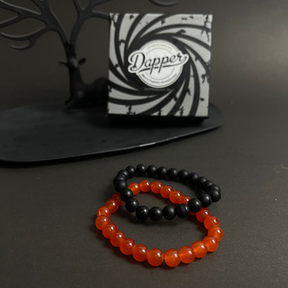 Red and black stone beads distance bracelet online in pakistan