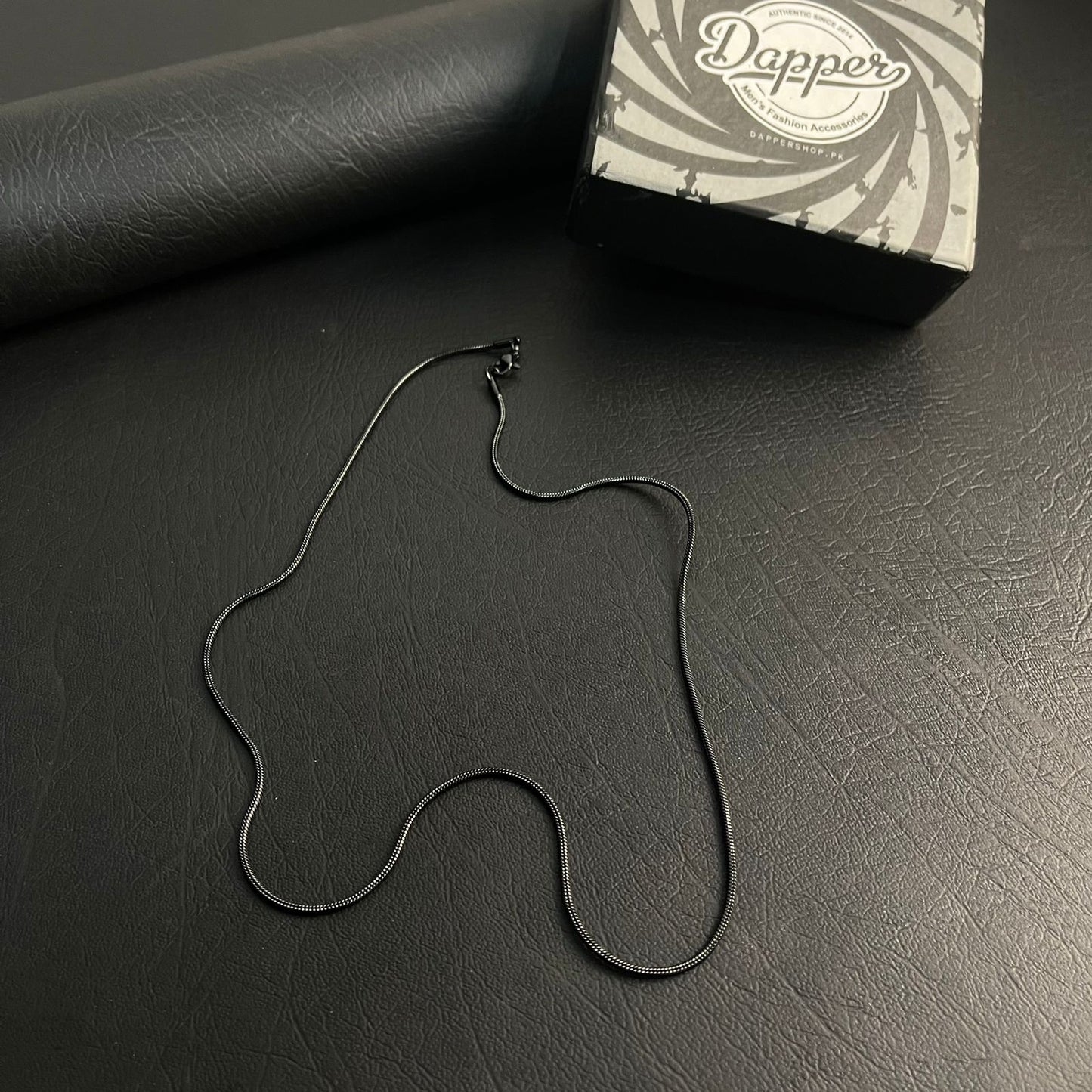 1mm sleek black round snake herringbone neck chain for men in Pakistan