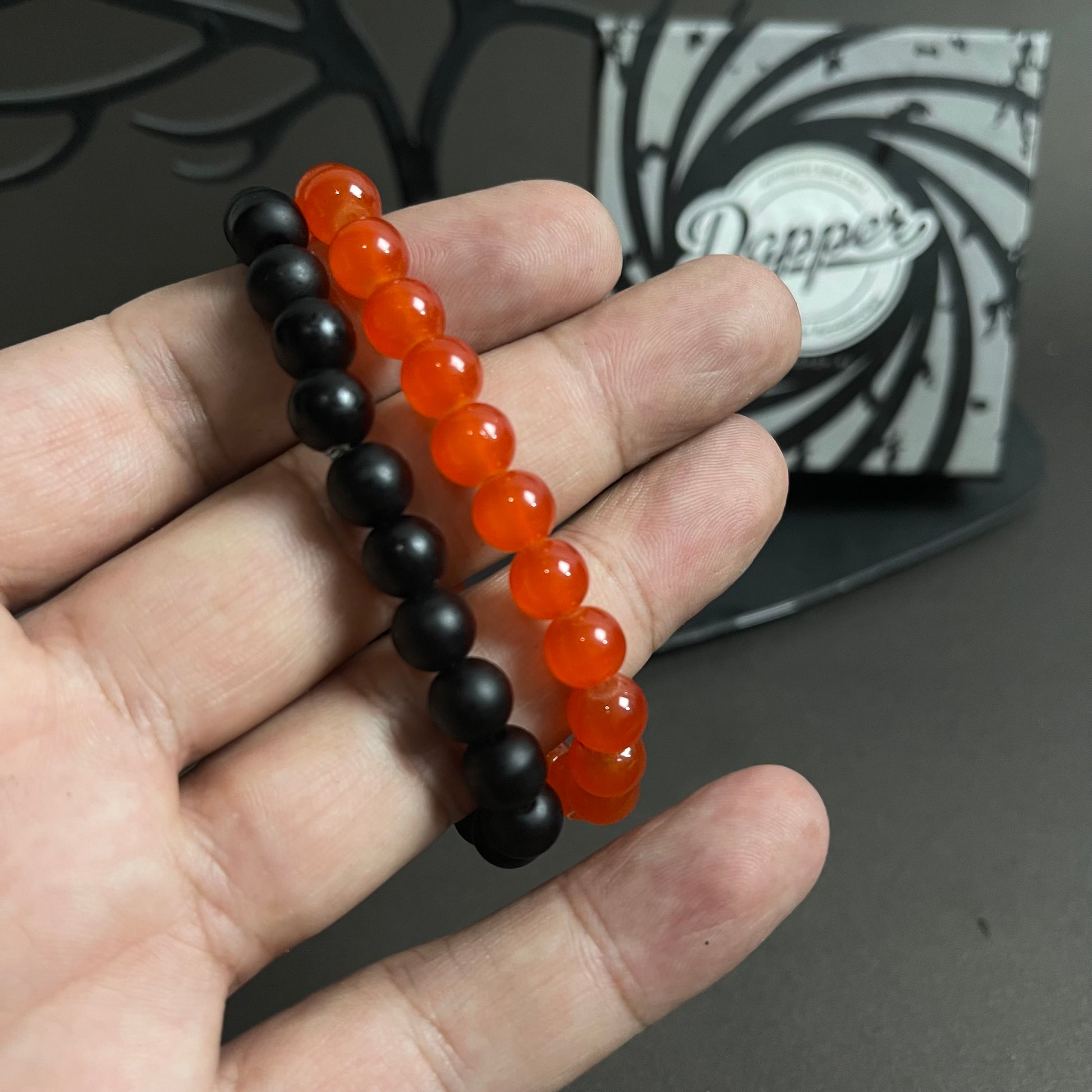 Red and black stone beads distance bracelet online in pakistan