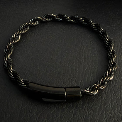 Close-up of black electroplated rope chain bracelet clasp and link detail