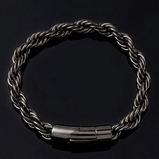 A dark metallic twisted rope chain bracelet with a polished cylindrical clasp, displayed on a solid black background.