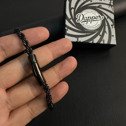 Black stainless steel rope chain bracelet for men held in hand