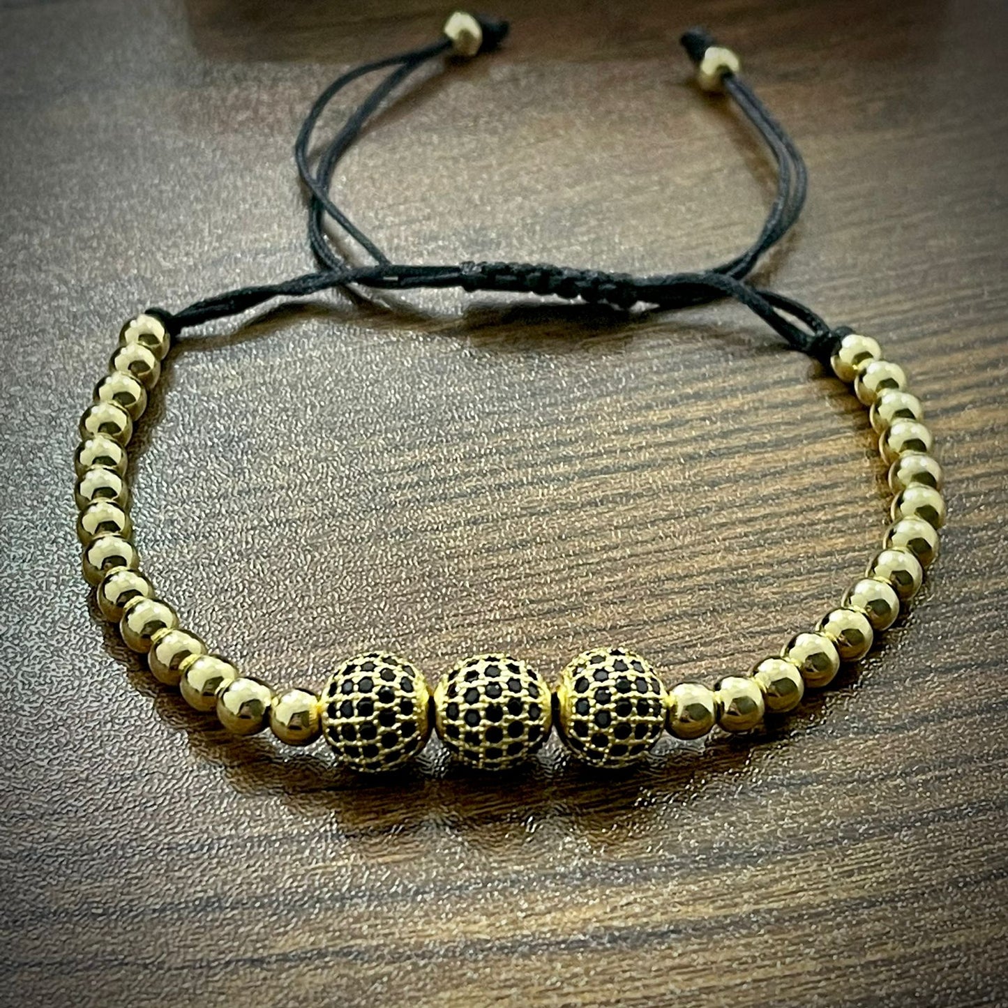 Golden Cubical Zircon Paved Triple Beads Bracelet